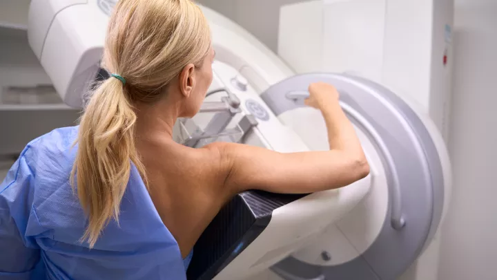 Woman getting a 3D mammogram