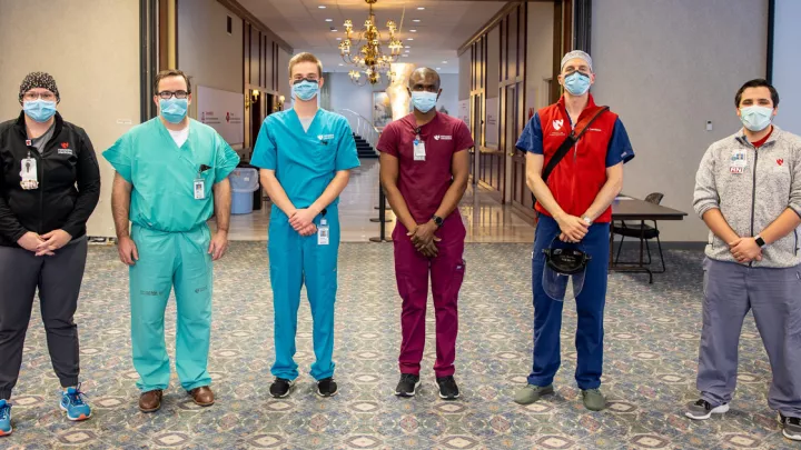 Here are the first six Nebraska Medicine health care workers to get the COVID-19 vaccine: Brandi Johansen, COVID-19 unit nurse manager; Dan W. Johnson, MD, critical care anesthesiologist; Martin Gilgenast, phlebotomist; Komi Gbedjeha, respiratory therapist; Ross Davidson, MD, UNMC chief pulmonary critical care fellow; and Kalen Knight, ER nurse.