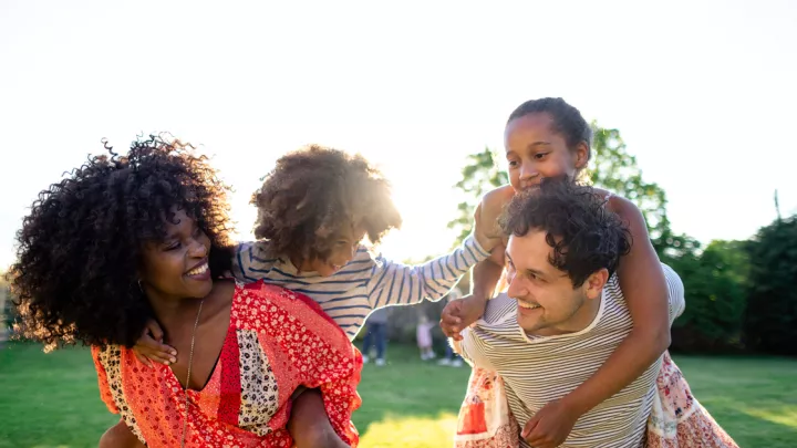 Mother, father, and two young daughters