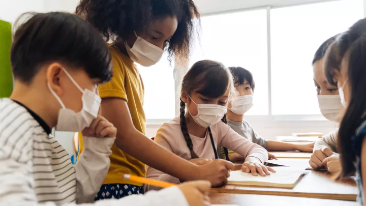 Teacher and students wearing masks