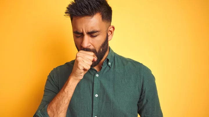 Man coughing