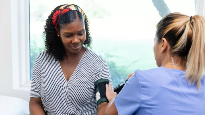 Woman getting her blood pressure checked