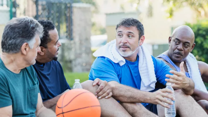 Group of men playing basketball