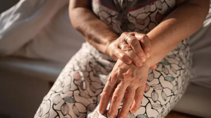 Woman holding her wrist