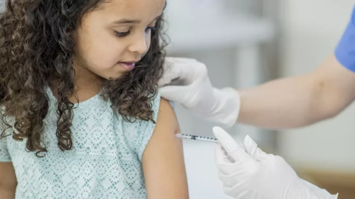 Young girl getting injection