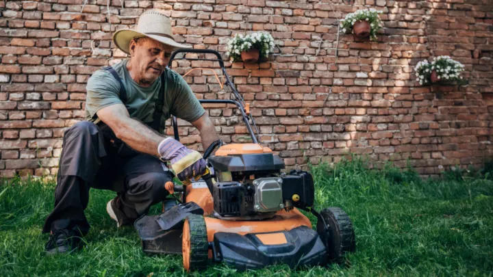 Man working on a lawnmower