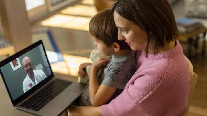 Mother and son on virtual visit with Nebraska Medicine doctor