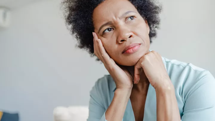Woman looking up worried