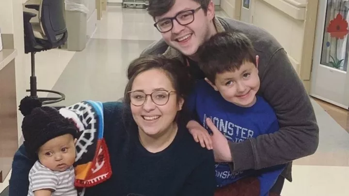 Ezra Fellers with mom Serena, dad Mark and big brother Anthony.