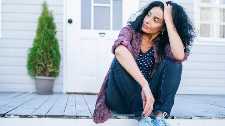 Woman sitting on porch